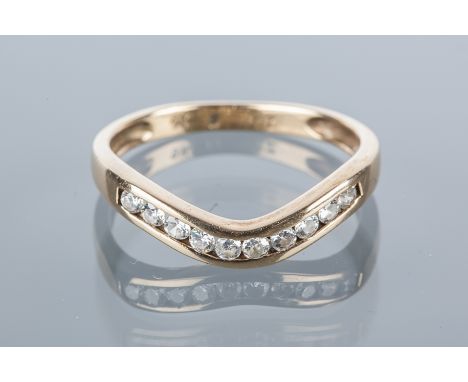 DIAMOND HALF ETERNITY RING
of wishbone form, channel set with brilliant cut diamonds, in nine carat gold, size N-O