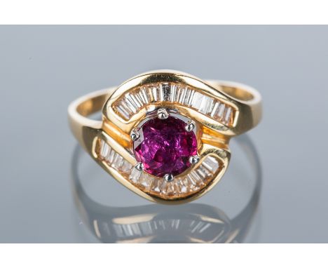 RUBY AND DIAMOND CLUSTER RING
the central round ruby flanked by two curved rows of channel set baguette cut diamonds, unmarke