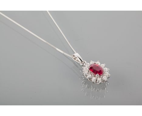 RUBY AND DIAMOND CLUSTER PENDANT ON CHAIN 
the pendant with central oval ruby 7mm long, surrounded by illusion set diamonds, 