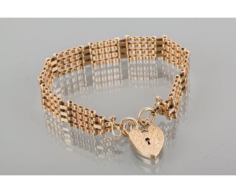 NINE CARAT GOLD GATE LINK BRACELET
with a heart shaped clasp, 15.3g