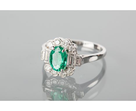 EDWARDIAN STYLE EMERALD AND DIAMOND RING
the central oval emerald 12x5mm flanked by two pairs of baguette cut diamonds and su