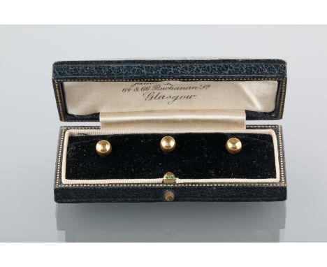 SET OF THREE EIGHTEEN CARAT GOLD SHIRT STUDS
early twentieth century, in a fitted case for R. Stewart of Buchanan Street, Gla