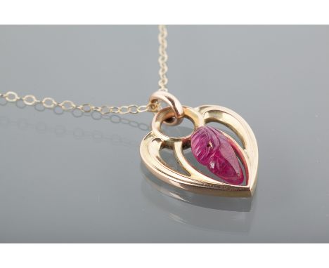 RUBY PENDANT ON CHAIN
the heart shaped pendant 24mm high with central carved ruby 13x7mm, in ten carat gold, on a nine carat 