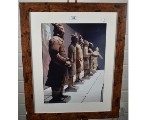 A modern photographic print of the terracotta soldiers, within a plain mount, modern wood effect frame, under glass 58cm x 48