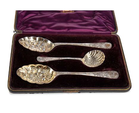 PAIR OF VICTORIAN SILVER AND PARCEL GILT BERRY SPOONS AND STRAINING SPOON,maker William Hutton &amp; Son, London 1904, the be