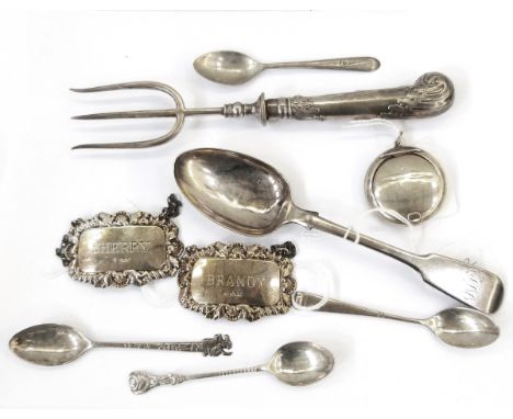 Two silver decanter labels, Sherry and Brandy, fiddle pattern silver dessert spoon, a bread fork, small silver butter knife, 