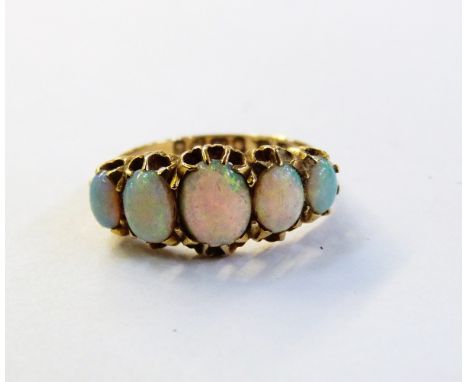 18ct gold and opal dress ring set five graduated oval cabochon opals, in claw setting 