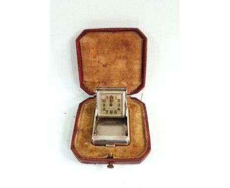 Tissot travelling purse clock, the square dial with Arabic numerals and inscribed 'Tissot Huber', in silver case of plain rec