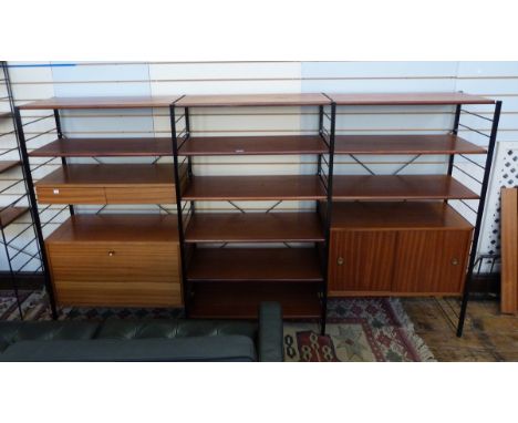 Triple Ladderax style black metal and hardwood shelving unit to include an upper section of two short drawers and cabinet bel