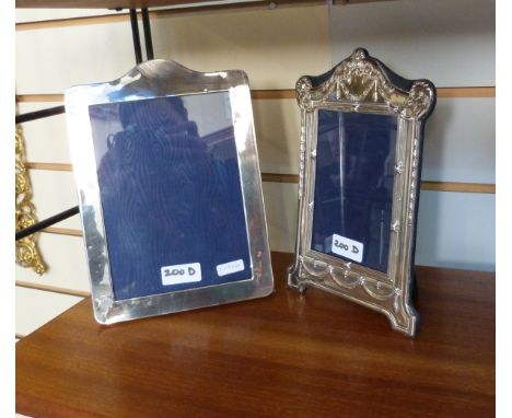 Modern silver-mounted photograph frame with arch and scroll top, husk swag and reed and ribband borders, bracket feet, 13cm x