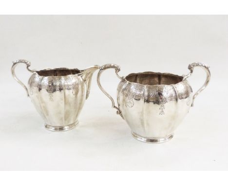 Silver two-handled sugar bowl and matching cream jug by William Suckling Limited, Birmingham 1959, of shaped circular form wi