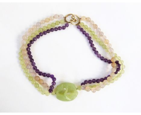 Three vintage Elizabeth Brady, New York necklaces, viz:- jade, amethyst and bead triple-strand necklace with carved oval pier