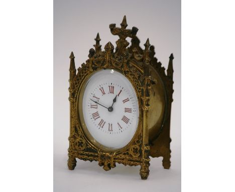A Victorian Gothic style brass cased mantel clock, 17cm high