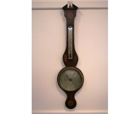 A 19th Century mahogany and satinwood inlaid banjo barometer, having broken arch pediment and brass urn finial above a thermo