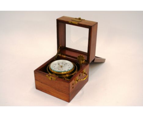 A Russian ship's chronometer, in mahogany and brass mounted double case, 25cm wide