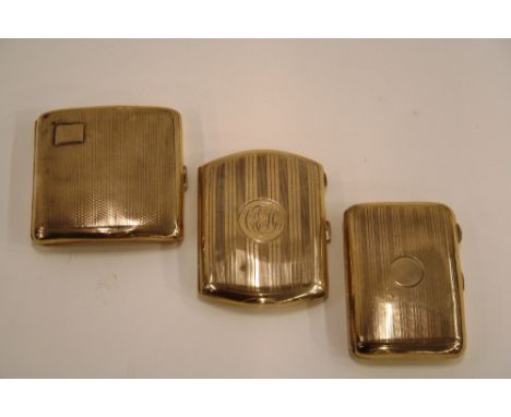 A silver engine turned cigarette case, Birmingham 1929; another with line decoration and monogram, Birmingham 1915; and a sma