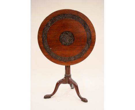 A 19th Century carved mahogany tripod table, the circular snap top with bird cage movement raised on turned column, 66cm dia.