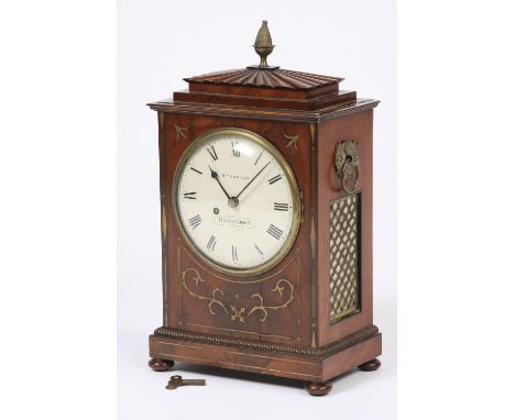 A 19th Century mahogany and brass inlaid bracket clock, surmounted by a  brass pineapple finial, flanked by ring handles, cir