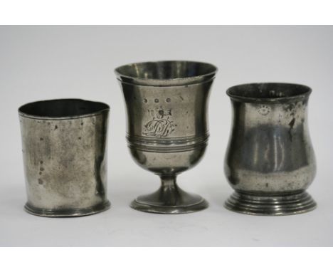 A 19th Century footed cup, with ring decoration, monogrammed, raised on a short stem and circular spread foot, 13cm; another 