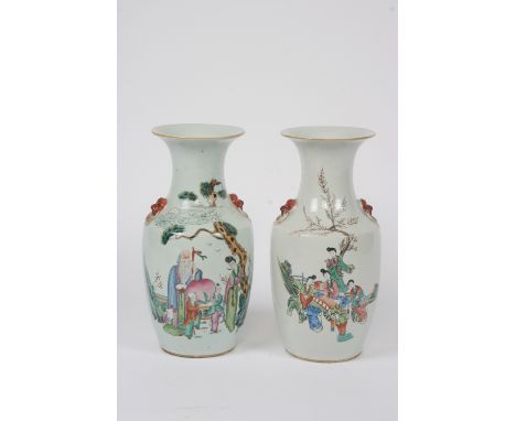 A pair of Chinese baluster vases, decorated with figures, prunus and symbols, flanked by beast mask ring handles, 42.5cm high