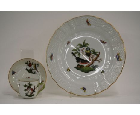 A quantity of Herend porcelain dinner and tea ware, profusely decorated with birds, butterflies and flowers within a shaped b