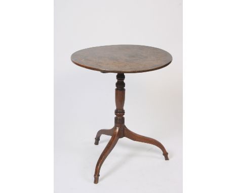 A 19th Century elm and oak tripod table, having circular top raised on a ring turned baluster column, 60cm dia.
