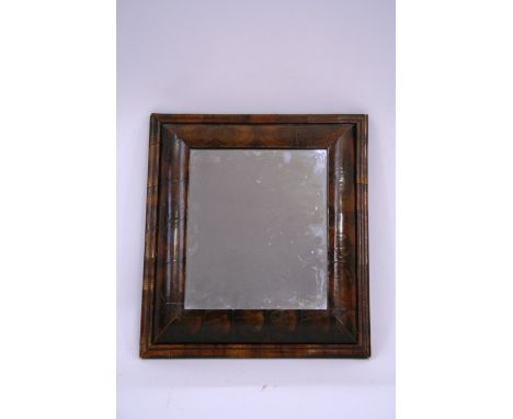 An 18th Century walnut oyster veneered cushion framed wall mirror; and a George III mahogany small cushion framed wall mirror