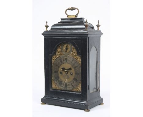 A mid 18th Century ebonised bracket clock, by John Hathaway, the inverted bell top case surmounted by a brass handle and four