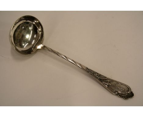A late 19th Century Russian silver ladle, with foliate decoration and monogram, figure 84 mark, 30cm long
