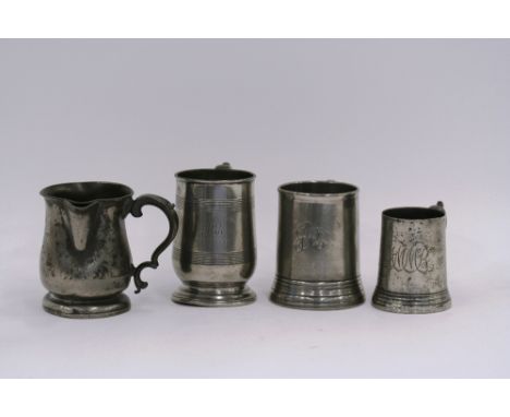 A side pouring baluster pint tankard, inscribed Unicorn Inn, Ipswich; a tulip shaped tankard, monogrammed; a glass bottomed t