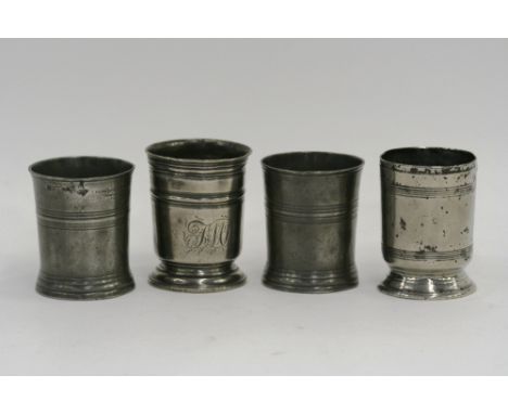 A 19th Century pint reeded body beaker, indistinct marks under the rim, 9.5cm high; another on footed base with ring decorati