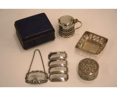 A silver mustard pot, having pierced sides and domed hinged lid, London 1901 with associated spoon; a small silver bonbon dis