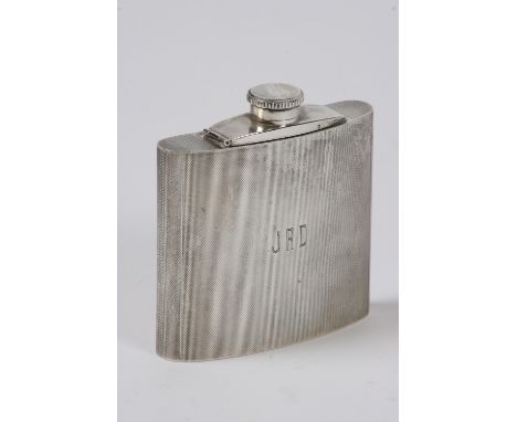 A silver hip flask, having engine turned decoration, Birmingham 1959, 10.5cm high - see illustration
