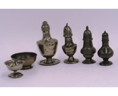 Two late 18th/early 19th Century sugar castors; and two similar period pepperettes; another pepperette of baluster form with 