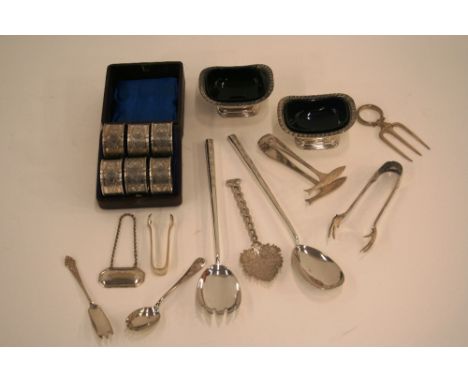 A cased set of six plated napkin rings, with engine turned and foliate decoration; various other plated items to include a pa