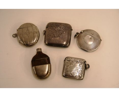 Three silver Vesta cases; a plated Vesta case of football shape, inscribed "Association"; and a Vesta case in the form of a m