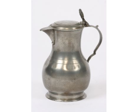 An early Flemish wine flagon, of bulbous form the lid with thumb piece, ring decoration to the body, touchmark to base I.B. M