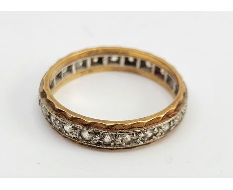 An 18ct. bi-colour gold and diamond eternity ring,&nbsp;set numerous round brilliant cut diamonds, size UK P. (gross weight 3