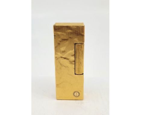 A Dunhill&nbsp;gilt metal Rollagas cigarette lighter, with textured finish.&nbsp;