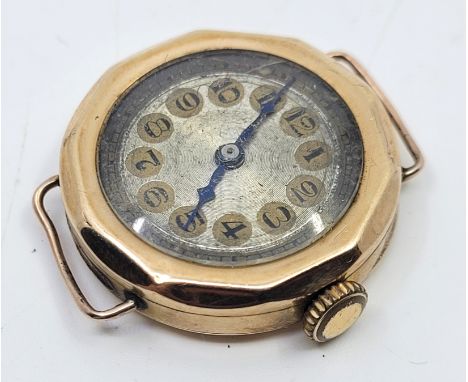 A 9ct. rose gold wrist watch, c.1925, having engine turned silver dial with Arabic numeral chapter ring, 25mm wide 9ct. gold 