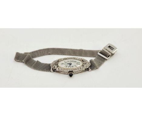 An Art Deco ladies platinum and diamond cocktail watch, manual movement, having oval enamel Arabic numeral dial, 15mm wide wh