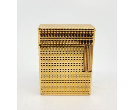 A Dupont gold plated cigarette lighter.&nbsp;