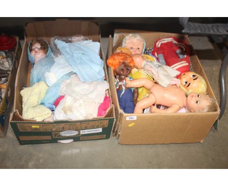 Two boxes of various vintage dolls and clothes