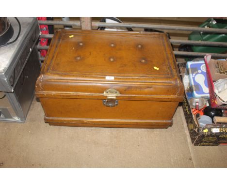 A metal twin handled travel trunk