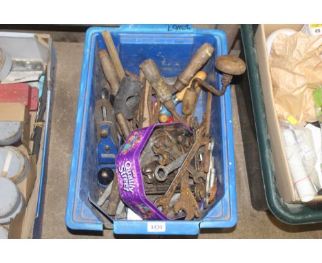 A plastic crate and contents of tools to include vintage spanners, a Record No.4 smoothing plane, hand brace, chisels etc.