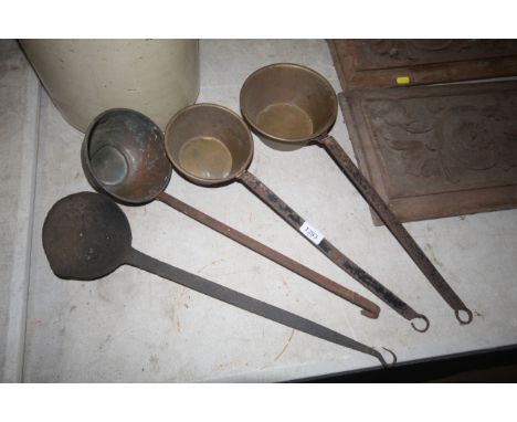 Two brass ladles, a coppered ladle and an iron ladle