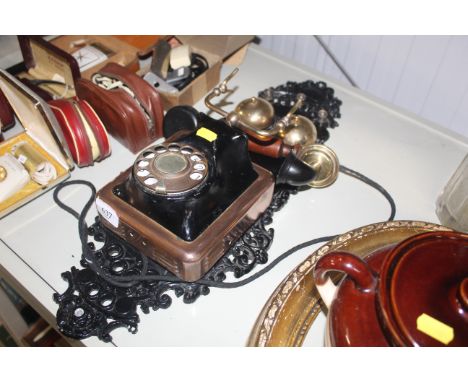 A vintage style wall mounting telephone