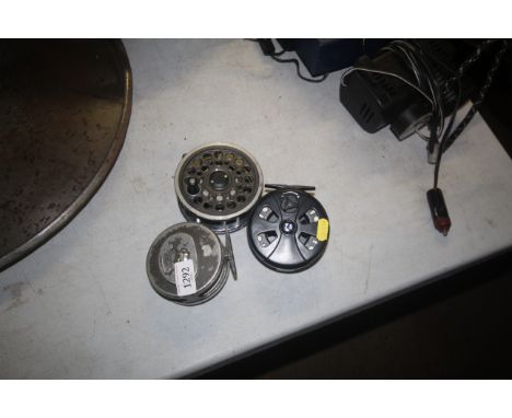 Three vintage fishing reels, one named to Rimfly, one Daiwa