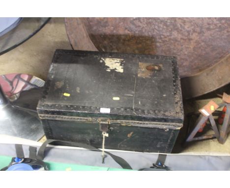 A travelling trunk named to "S. Smith" with key