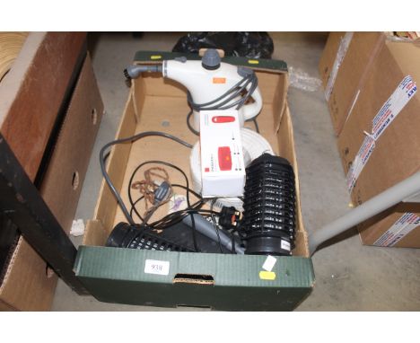 A box containing Vax steam cleaner, roll of cable, two insect killers, a charge portable mini speaker